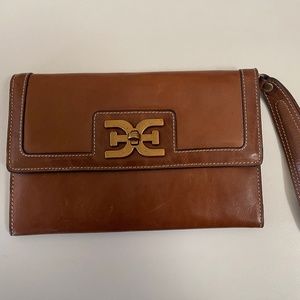 Sam Edelman Leather wristlet with a gold-tone logo hardware